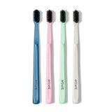 Boka Classic Manual Toothbrush with Extra Soft Activated-Charcoal, Tapered Bristles, Bioplastic Handle that Includes Travel Cap, Dentist-Approved, Self-Care Daily Brushing Ritual, Multi Color (Pack of 4)