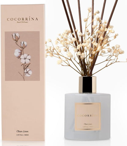 200 ml (6.7 fl oz) glass diffuser bottle with real preserved baby's breath or rose stem as visual focal point