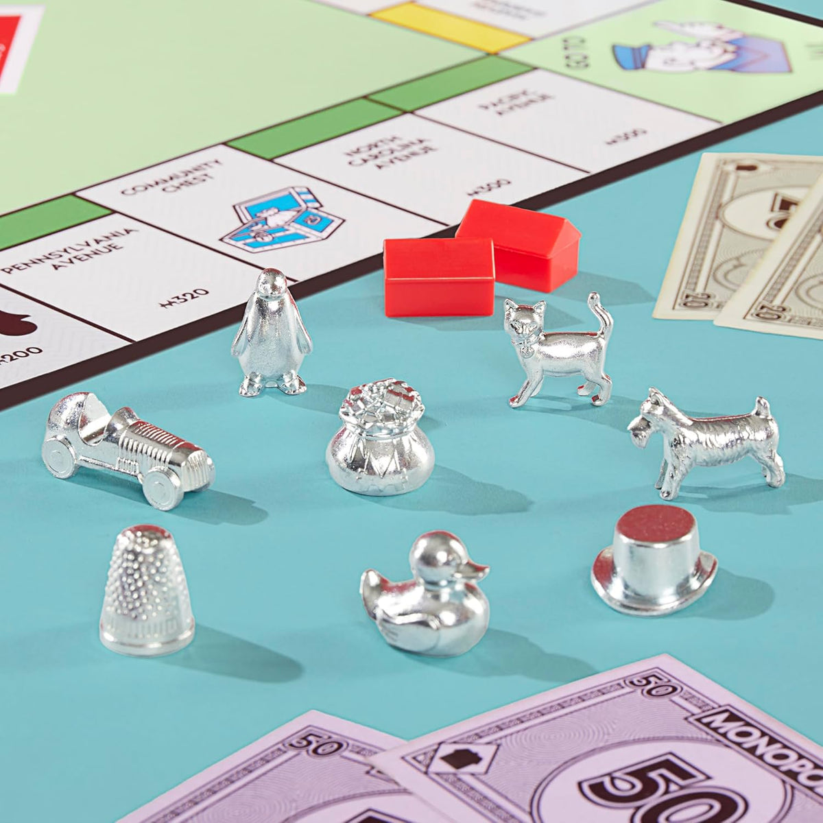 larger-sized houses and hotels compared to prior editions for easier handling