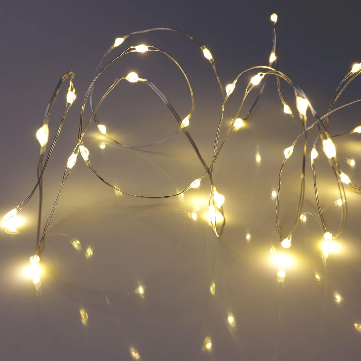 QBIS Warm White Micro LED Lights – 6.5ft Thin Silver Wire for Clean, Uncluttered Bedroom and Studio Apartment Styling