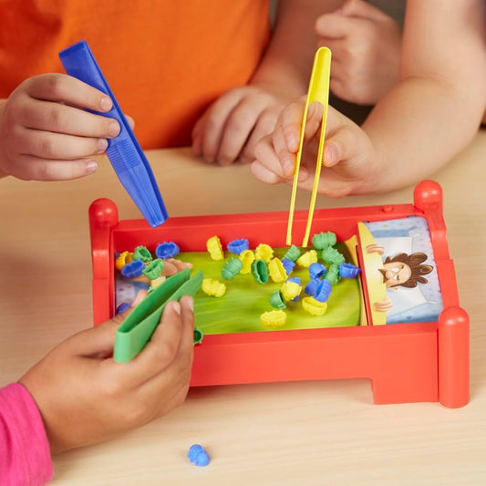 three color-coded tongs (blue, yellow, green) for color-matching bug catching